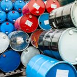 old-chemical-barrels-on-wooden-pallet-blue-and-re-2026-03-18-04-35-24-utc (1)