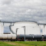 row-many-large-industrial-fuel-storage-white-tanks-2026-03-17-06-55-35-utc (2)