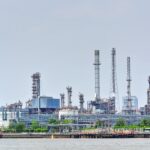 large-oil-refinery-plant-by-the-river-2026-03-09-03-23-43-utc (1)