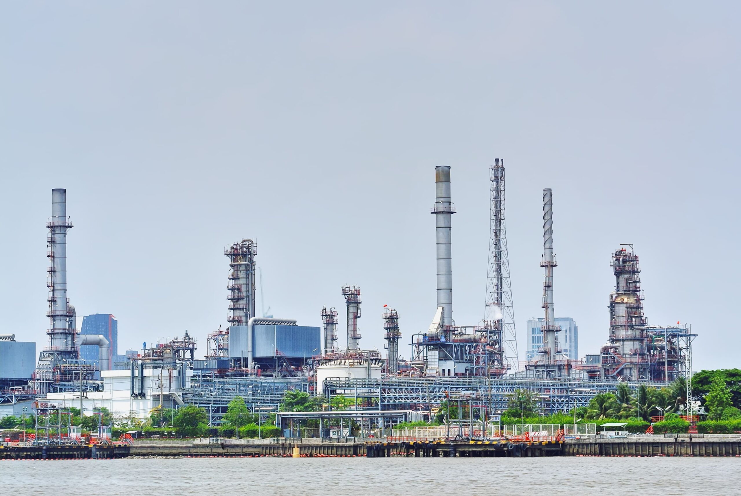 large-oil-refinery-plant-by-the-river-2026-03-09-03-23-43-utc (1)